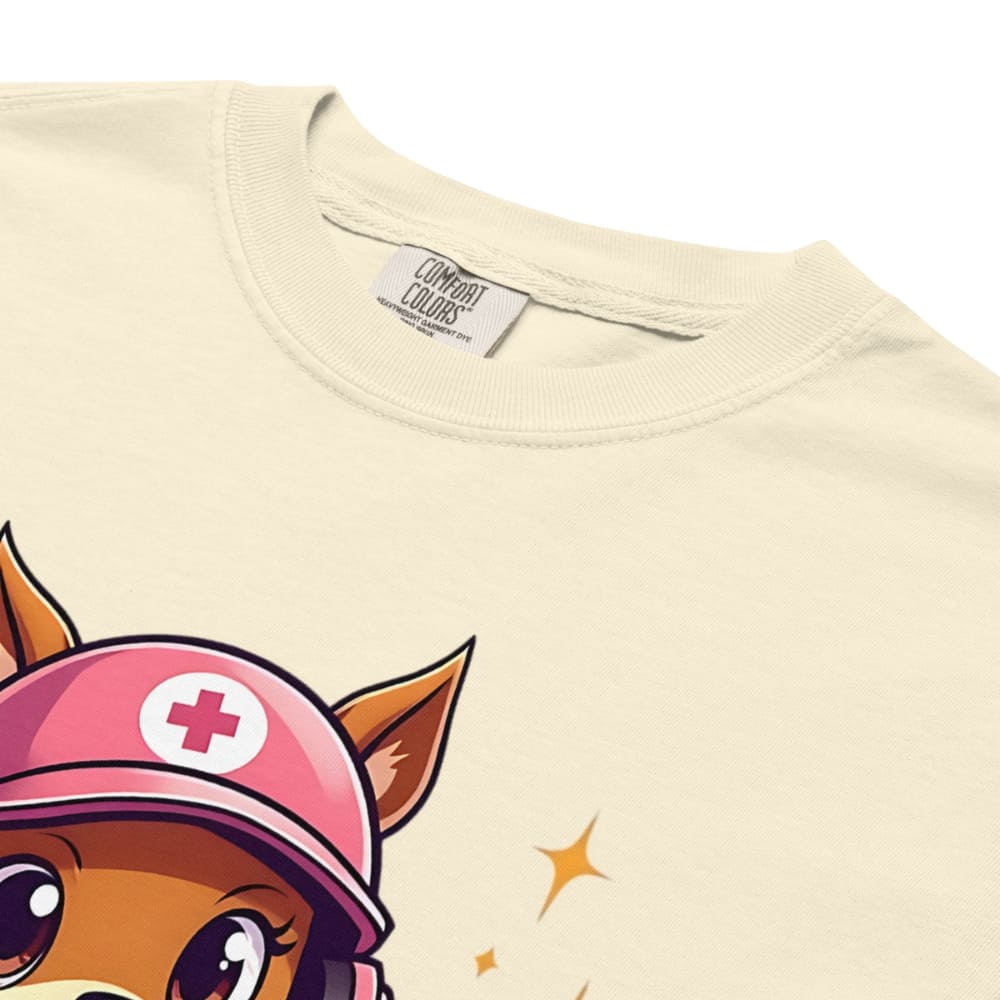 Cute squirrel nurse cartoon in scrubs, pink cap, and headset holding a softball and medical kit with the phrase “Saving Lives Between Innings” — printed on a heavyweight cotton t-shirt