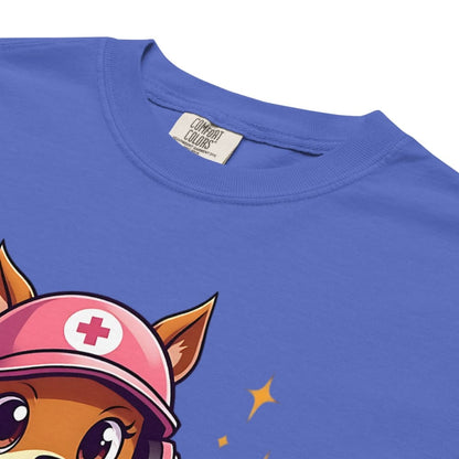Cute squirrel nurse cartoon in scrubs, pink cap, and headset holding a softball and medical kit with the phrase “Saving Lives Between Innings” — printed on a heavyweight cotton t-shirt