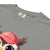 Cute cartoon owl cheerleader holding a pom-pom and clipboard, wearing a red cap with the quote “Behind Every Great Swing Is a Loud Mom” – featured on garment-dyed heavyweight cotton tee