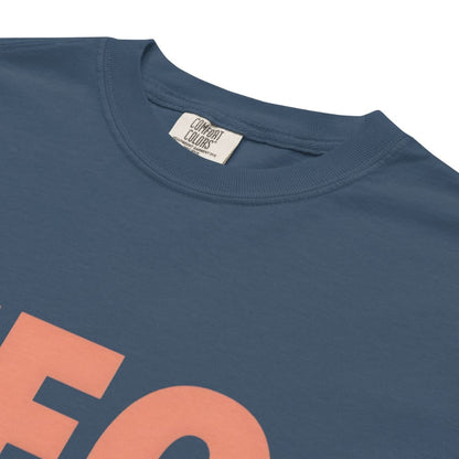 CEO of the Chaos” printed on a heavyweight cotton t-shirt in soft pastel ink, laid flat with a minimal lifestyle background.