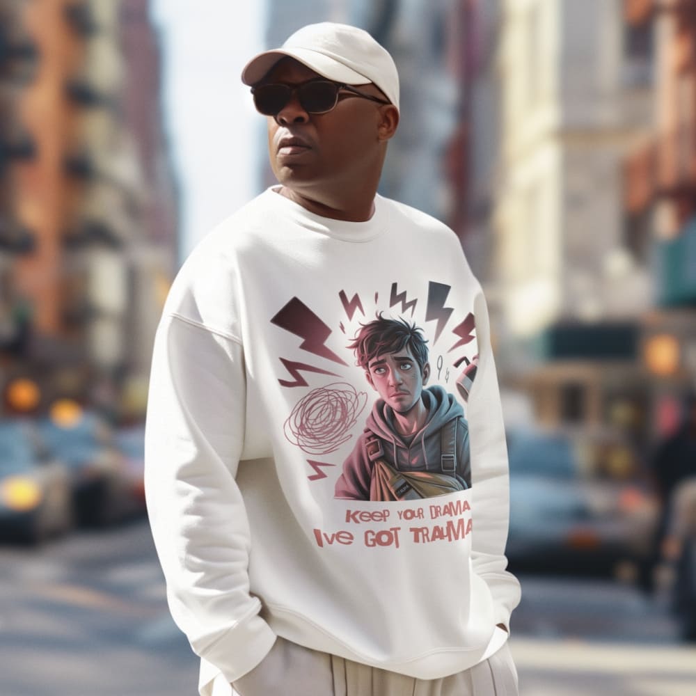 Person wearing a white sweatshirt with a graphic design on a city street
