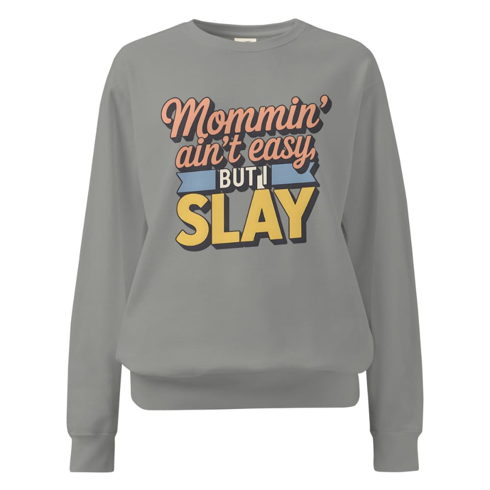 “Mommin' Ain’t Easy But I Slay” retro-style DTG printed design in peach, blue, and yellow on vintage garment-dyed fleece sweatshirt