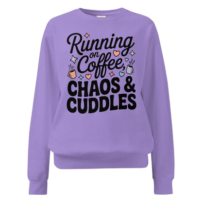 Purple sweatshirt with text 'Running on Coffee, Chaos & Cuddles' on a white background