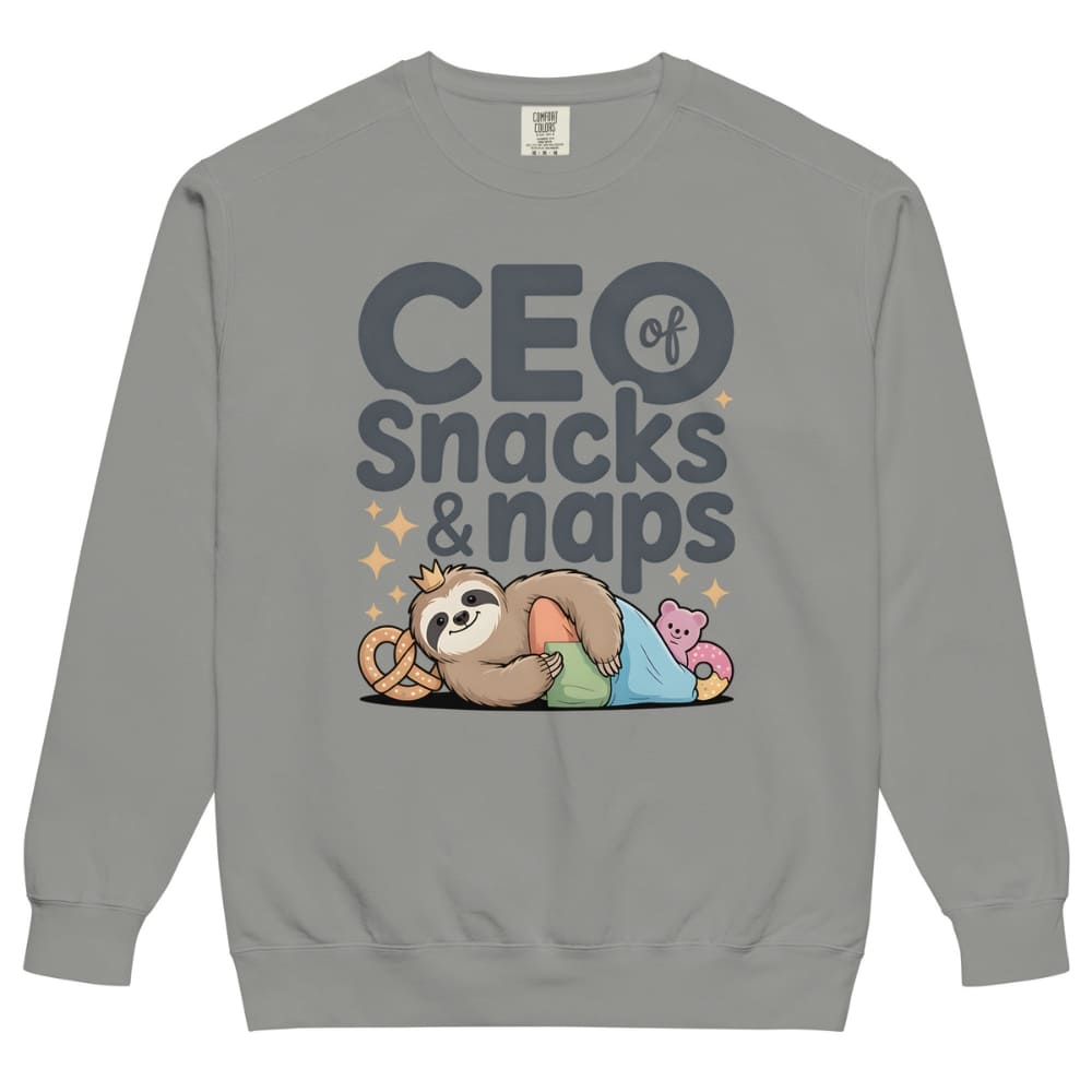 "CEO of Snacks & Naps" printed sweatshirt featuring a sloth in a crown surrounded by pretzels and plushies on vintage-washed cotton fleece