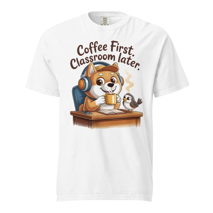 White t-shirt with a cartoon dog wearing headphones and holding a coffee cup, with text 'Coffee First, Classroom Later' on a white background.