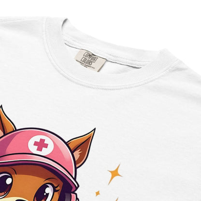Cute squirrel nurse cartoon in scrubs, pink cap, and headset holding a softball and medical kit with the phrase “Saving Lives Between Innings” — printed on a heavyweight cotton t-shirt