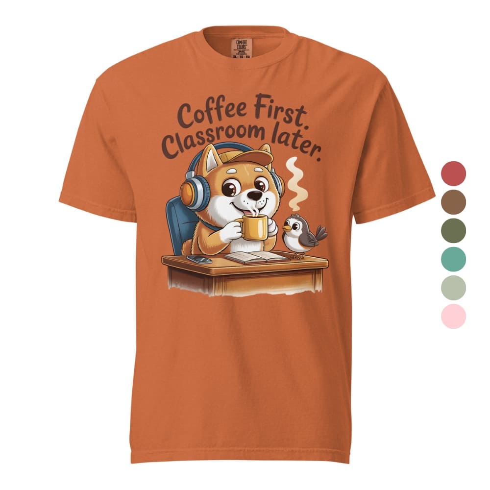 Orange t-shirt with a cartoon dog and bird design and text 'Coffee First, Classroom Later' on a white background.