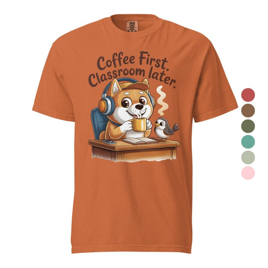 Orange t-shirt with a cartoon dog and bird design and text 'Coffee First, Classroom Later' on a white background.