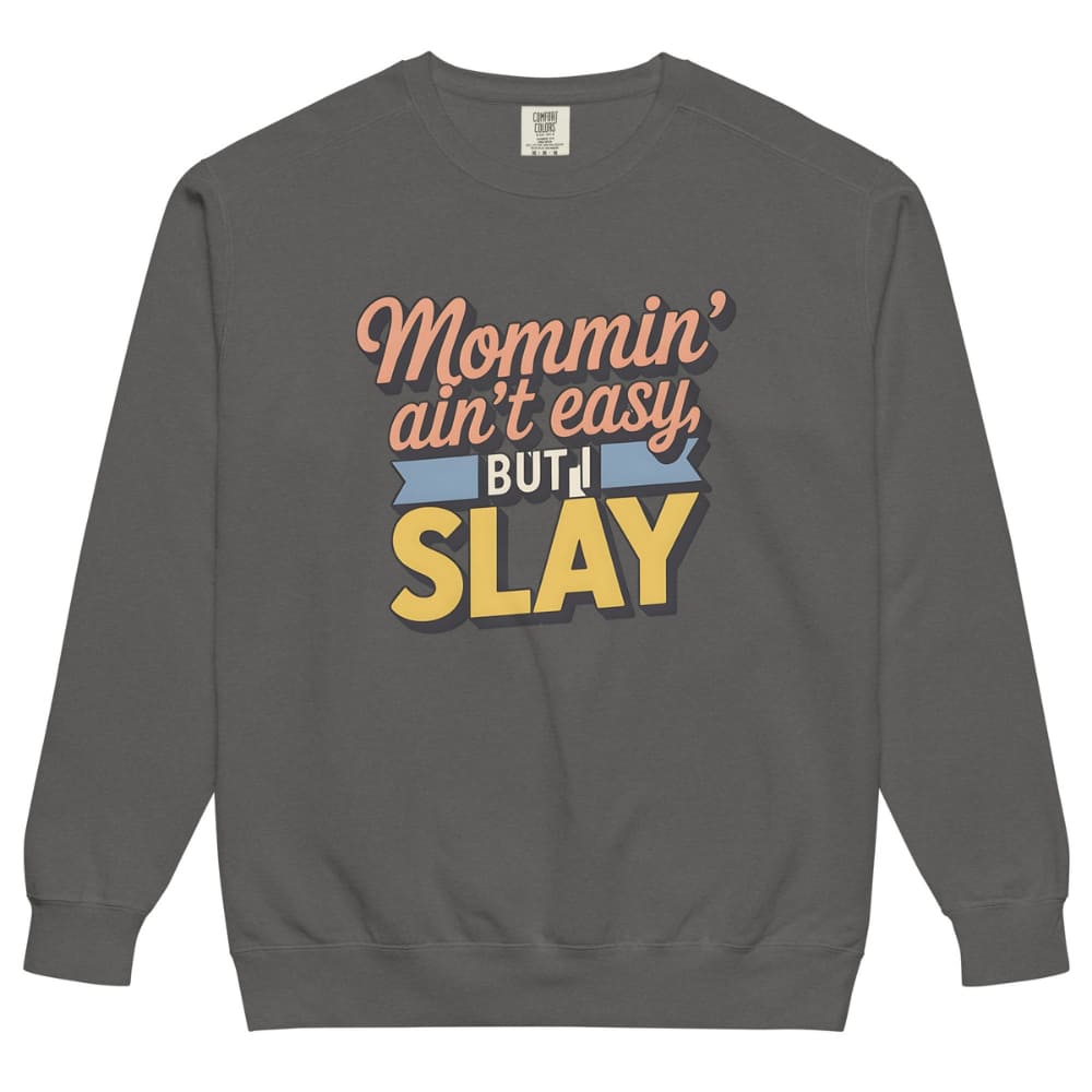 “Mommin' Ain’t Easy But I Slay” retro-style DTG printed design in peach, blue, and yellow on vintage garment-dyed fleece sweatshirt