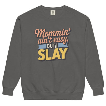 “Mommin' Ain’t Easy But I Slay” retro-style DTG printed design in peach, blue, and yellow on vintage garment-dyed fleece sweatshirt