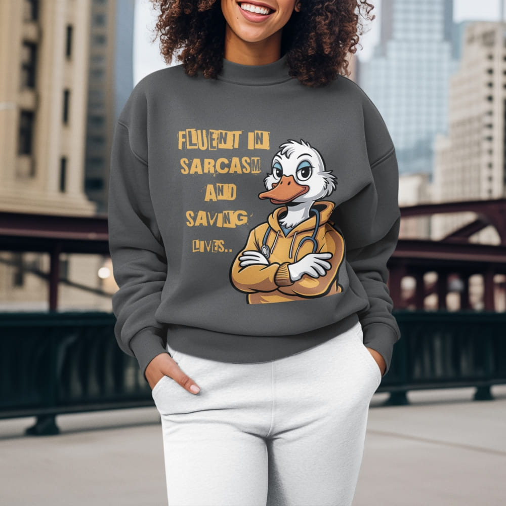Person wearing a sweatshirt with a cartoon character and text in an urban setting