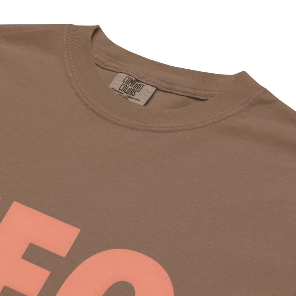 CEO of the Chaos” printed on a heavyweight cotton t-shirt in soft pastel ink, laid flat with a minimal lifestyle background.