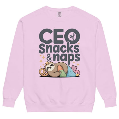 "CEO of Snacks & Naps" printed sweatshirt featuring a sloth in a crown surrounded by pretzels and plushies on vintage-washed cotton fleece