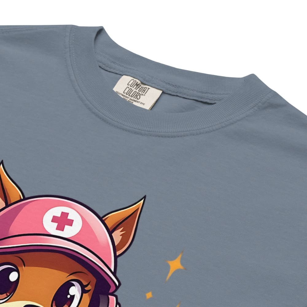 Cute squirrel nurse cartoon in scrubs, pink cap, and headset holding a softball and medical kit with the phrase “Saving Lives Between Innings” — printed on a heavyweight cotton t-shirt