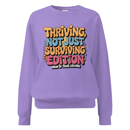Purple sweatshirt with colorful text on a white background