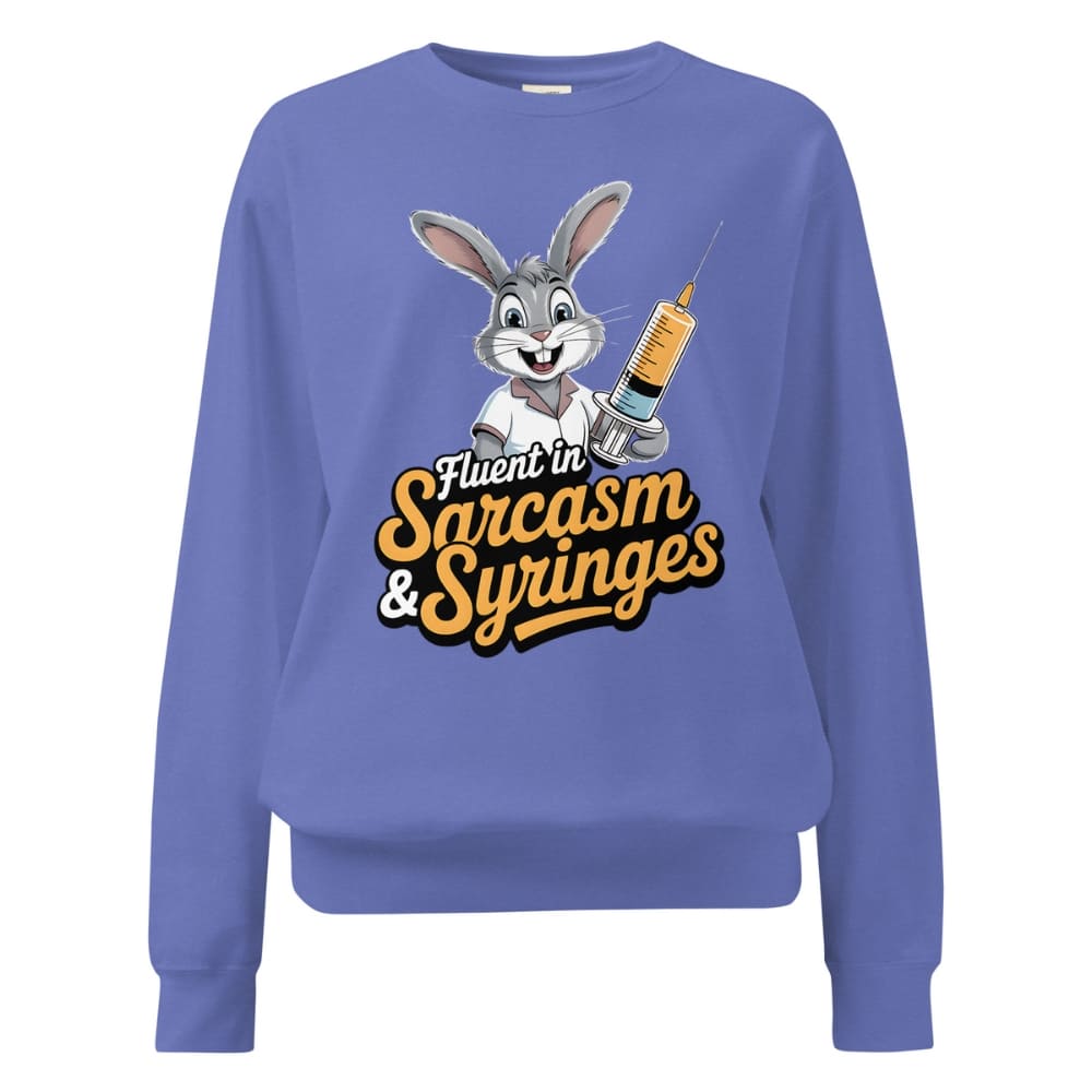 Blue sweatshirt with cartoon character and text ' Fluent in Sarcasm & Syringes' on a white background