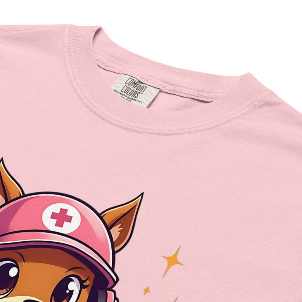 Cute squirrel nurse cartoon in scrubs, pink cap, and headset holding a softball and medical kit with the phrase “Saving Lives Between Innings” — printed on a heavyweight cotton t-shirt