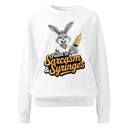 White sweatshirt with cartoon character holding a syringe and text ' Fluent in Sarcasm & Syringes' on a white background