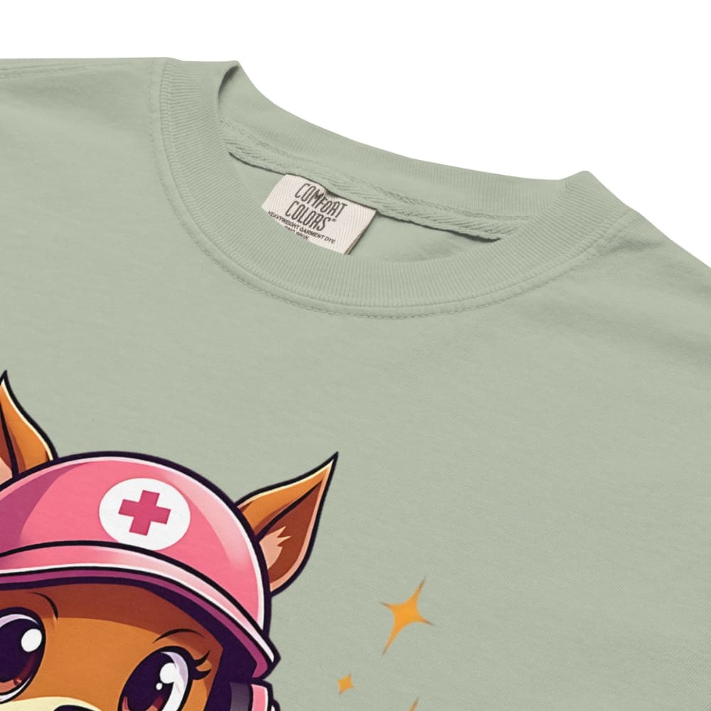 Cute squirrel nurse cartoon in scrubs, pink cap, and headset holding a softball and medical kit with the phrase “Saving Lives Between Innings” — printed on a heavyweight cotton t-shirt