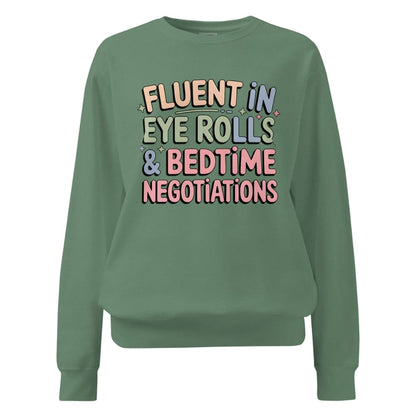 Green sweatshirt with colorful text on a white background
