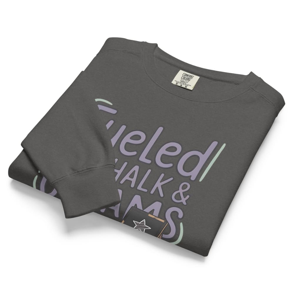 Fueled by Chalk & Dreams printed design on a vintage-style garment-dyed sweatshirt with chalkboard illustration – soft fleece ideal for teachers