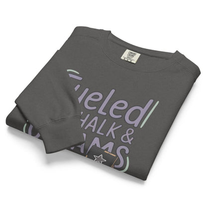 Fueled by Chalk & Dreams printed design on a vintage-style garment-dyed sweatshirt with chalkboard illustration – soft fleece ideal for teachers
