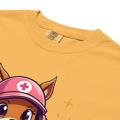 Cute squirrel nurse cartoon in scrubs, pink cap, and headset holding a softball and medical kit with the phrase “Saving Lives Between Innings” — printed on a heavyweight cotton t-shirt