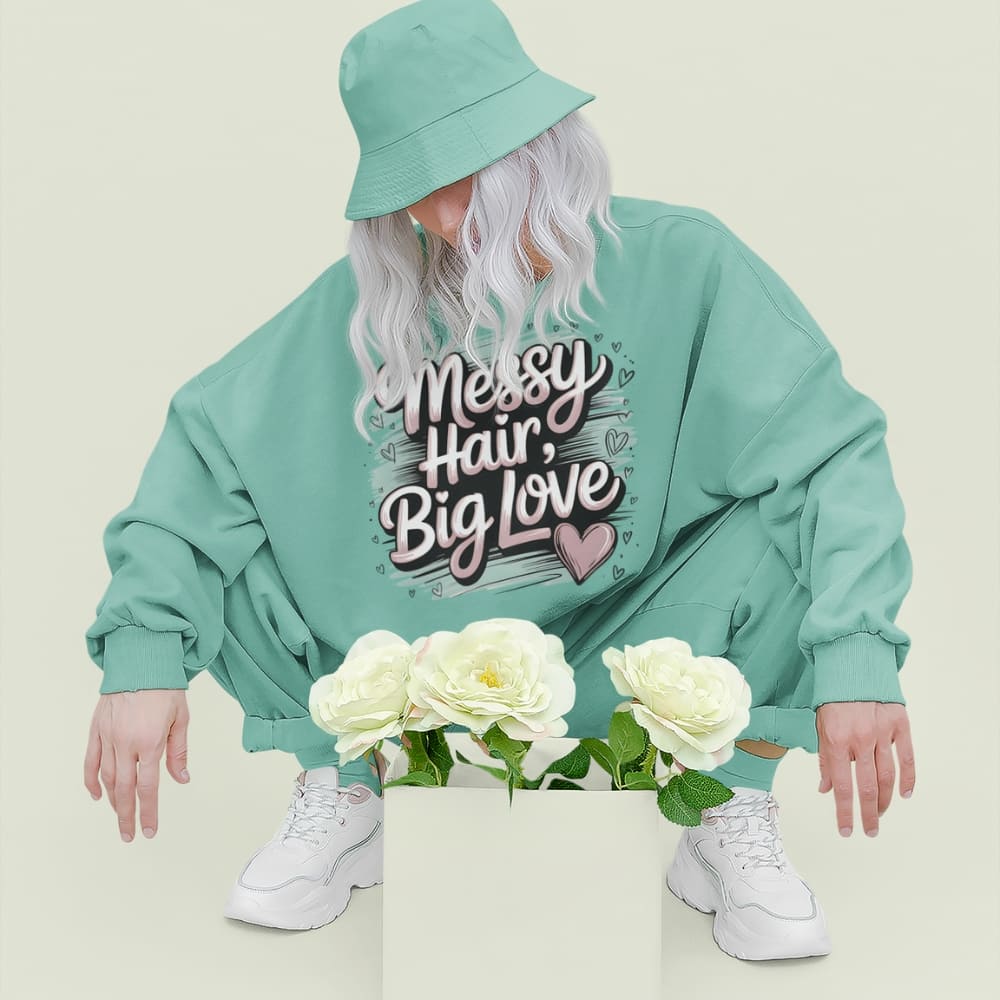 Pastel brushstroke design with “Messy Hair, Big Love” printed text on a vintage garment-dyed sweatshirt – cozy fleece for moms and creators