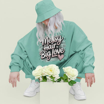 Pastel brushstroke design with “Messy Hair, Big Love” printed text on a vintage garment-dyed sweatshirt – cozy fleece for moms and creators