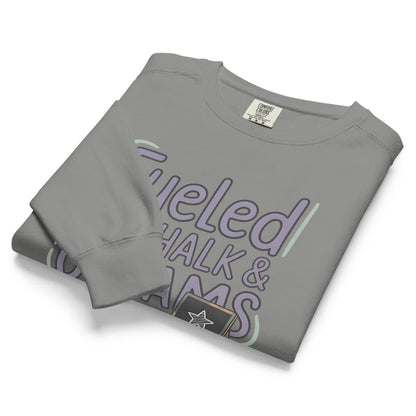 Fueled by Chalk & Dreams printed design on a vintage-style garment-dyed sweatshirt with chalkboard illustration – soft fleece ideal for teachers