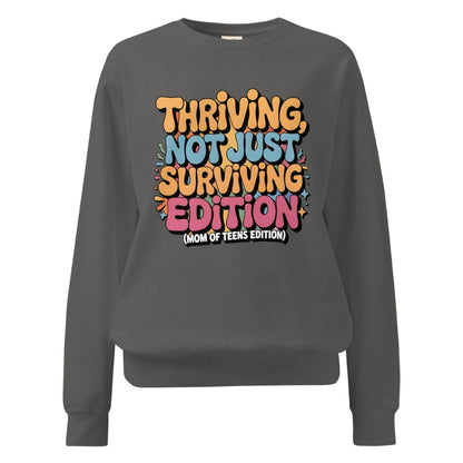 Gray sweatshirt with colorful text design on a white background