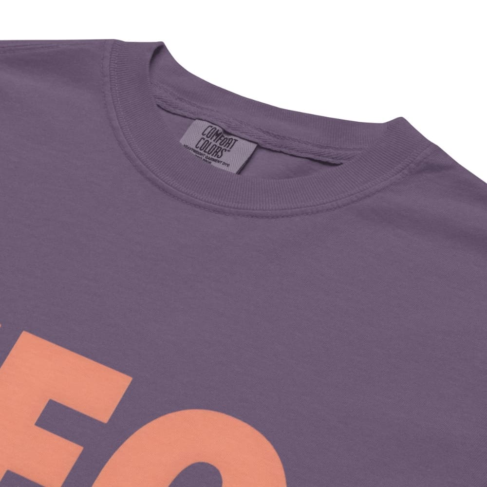 CEO of the Chaos” printed on a heavyweight cotton t-shirt in soft pastel ink, laid flat with a minimal lifestyle background.