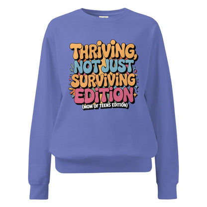Blue sweatshirt with colorful text design on a white background