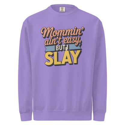 “Mommin' Ain’t Easy But I Slay” retro-style DTG printed design in peach, blue, and yellow on vintage garment-dyed fleece sweatshirt