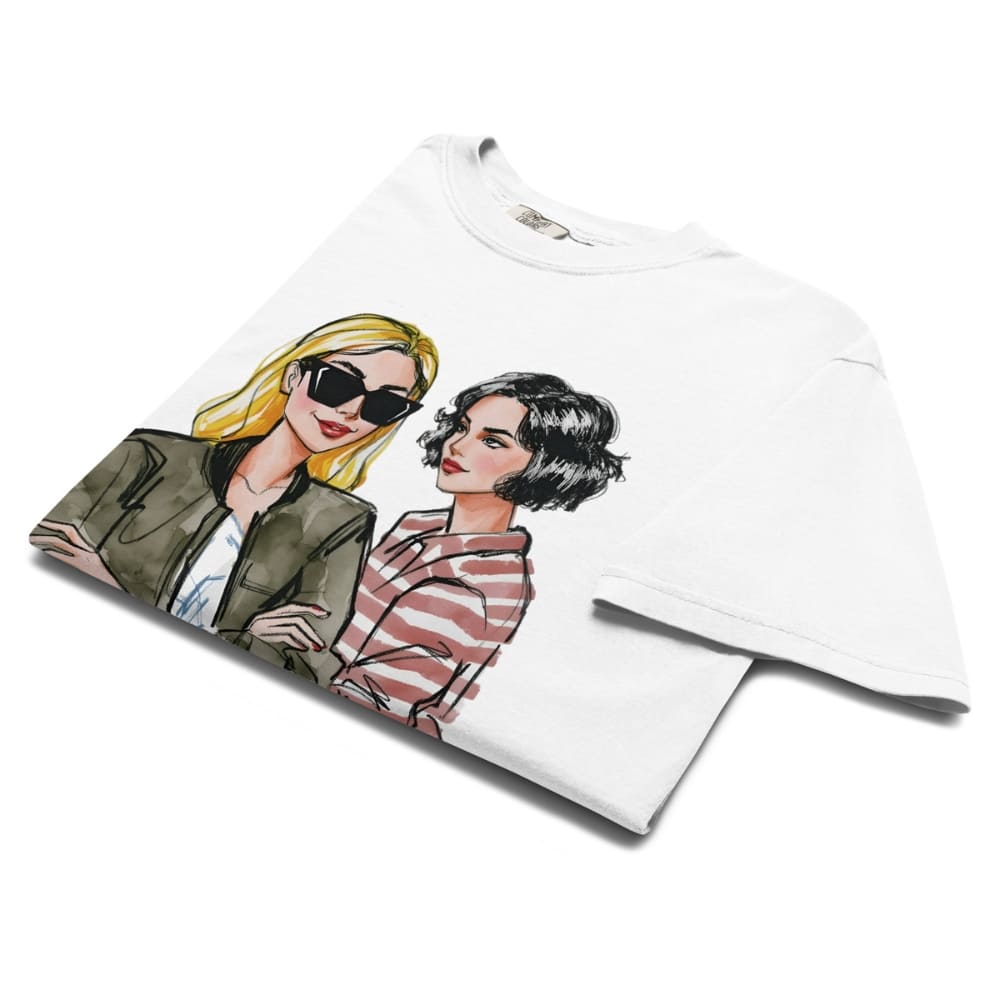 White t-shirt with illustrated design of two women on a white background