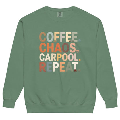 Green sweatshirt with colorful text 'COFFEE. CHAOS. CARPOOL. REPEAT.' on a white background