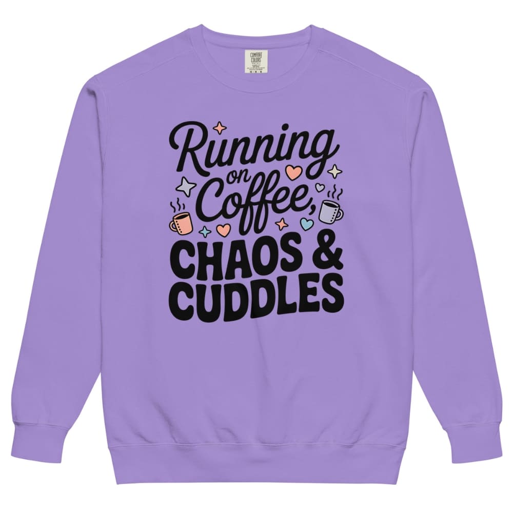 Purple sweatshirt with text 'Running on Coffee, Chaos & Cuddles' on a white background
