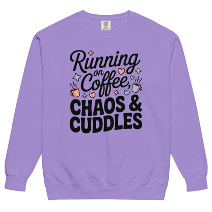 Purple sweatshirt with text 'Running on Coffee, Chaos & Cuddles' on a white background