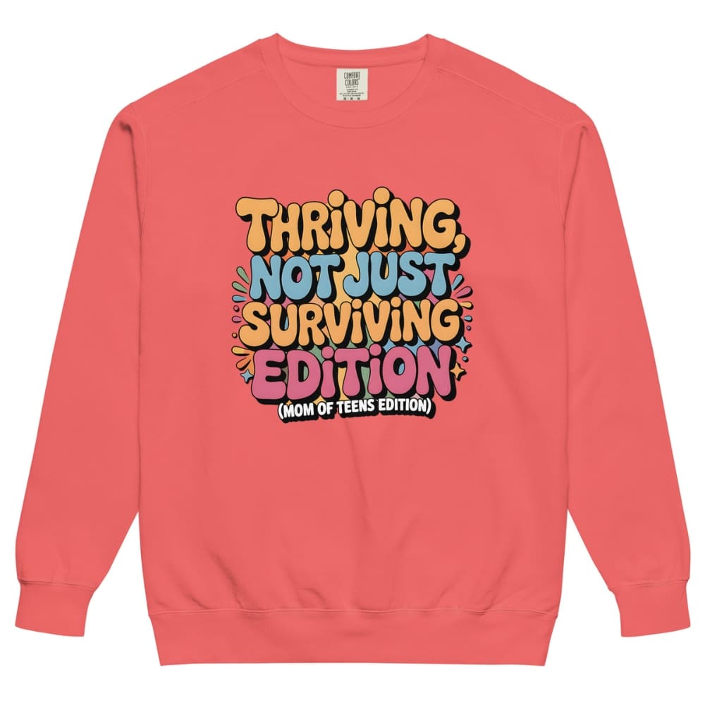 Coral sweatshirt with colorful text design on a white background