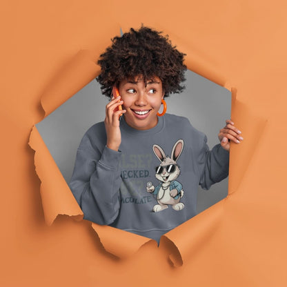 Person wearing a sweatshirt with a cartoon character, framed by a torn orange paper effect.