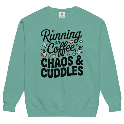 Teal sweatshirt with text 'Running on Coffee, Chaos & Cuddles' on a white background