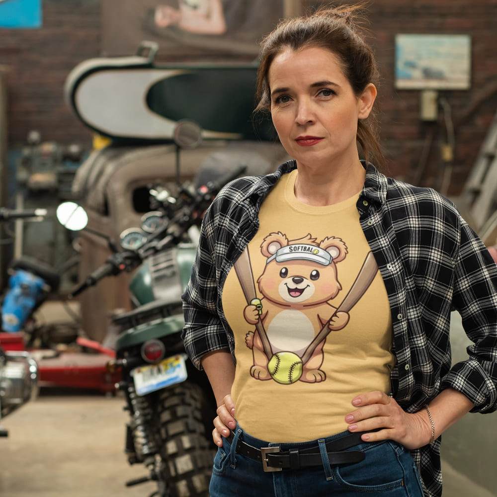 Cartoon bear holding softball bats and ball wearing a visor labeled “Softball” – printed on garment-dyed heavyweight t-shirt for sporty moms