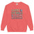 Coral sweatshirt with colorful text on a white background