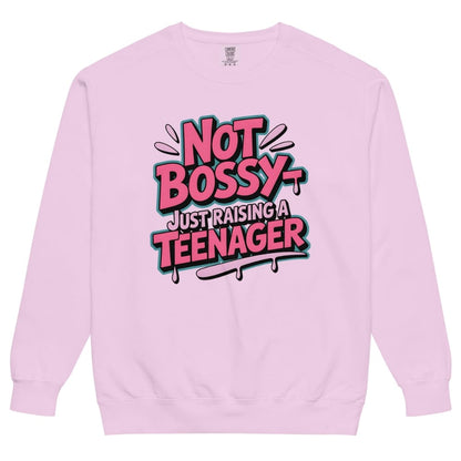Pink sweatshirt with 'Not Bossy Just Raising a Teenager' text on a white background