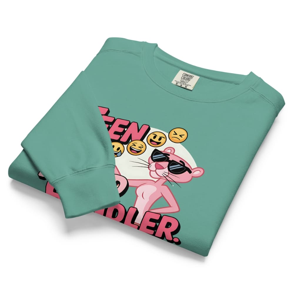 Folded teal sweatshirt with a graphic design of the Pink Panther on a white background