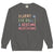 Gray sweatshirt with colorful text 'Fluent in Eye Rolls & Bedtime Negotiations' on a white background