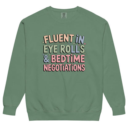 Green sweatshirt with colorful text on a white background