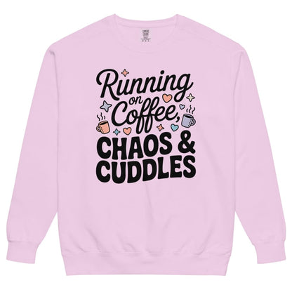 Pink sweatshirt with text 'Running on Coffee, Chaos & Cuddles' on a white background