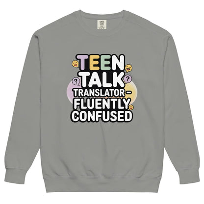 Gray sweatshirt with colorful text 'TEEN TALK TRANSLATOR FLUENTLY CONFUSED' on a white background