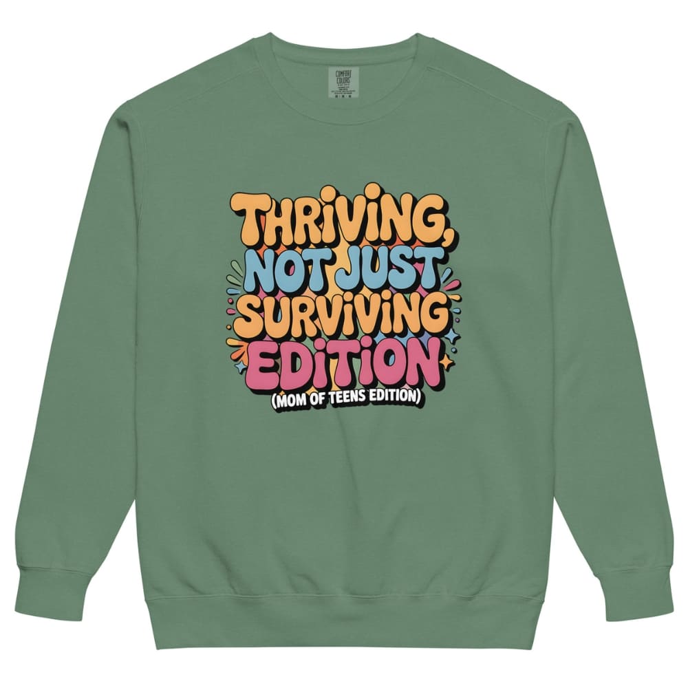Green sweatshirt with colorful text design on a white background